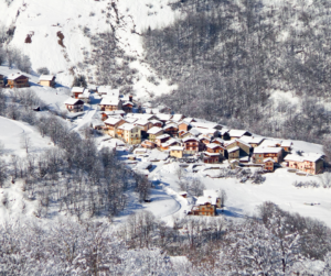 View from above looking down into the quaint town of St. Martin de Belleville, France in winter.